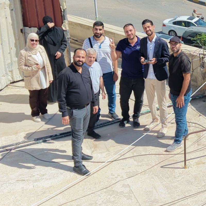 The workshop team on a rooftop in Douma